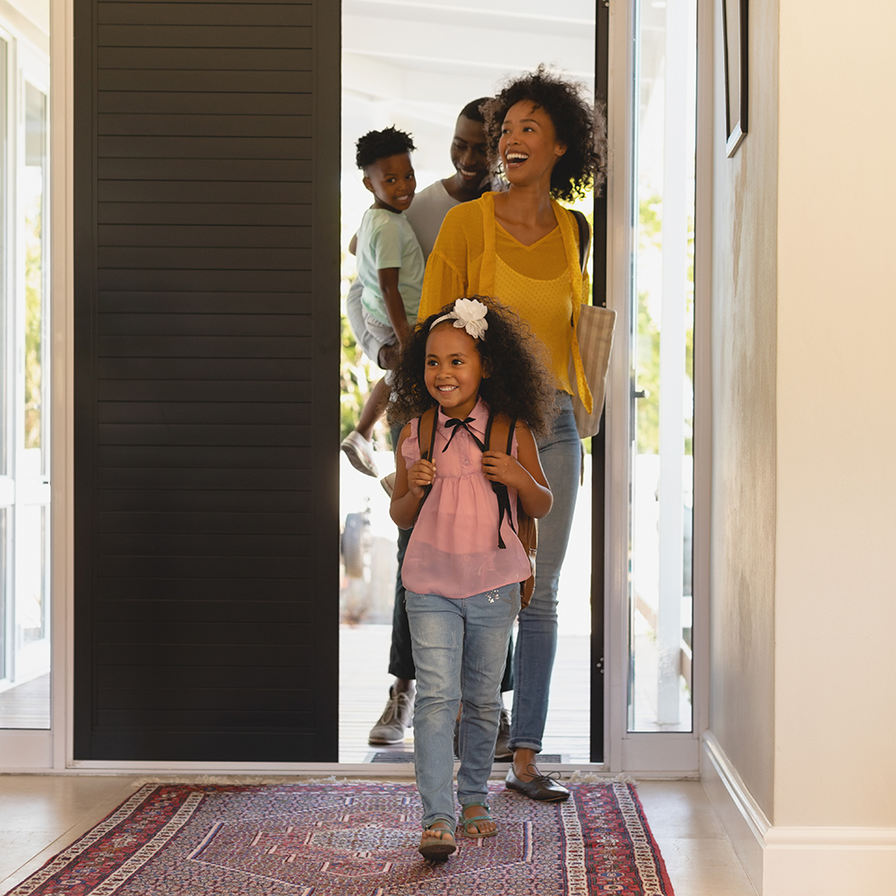 happy family entering home